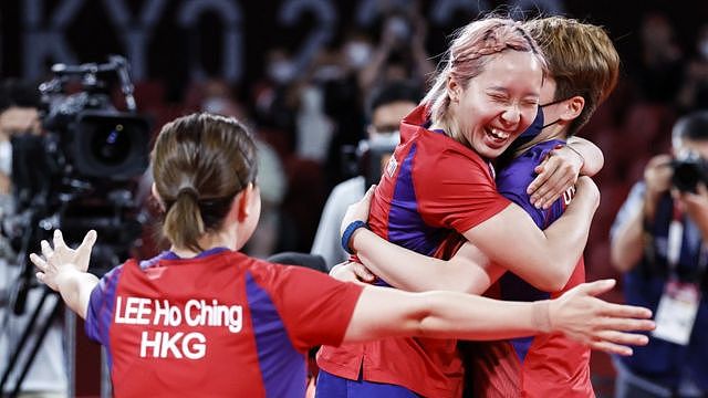 Lee Ho-ching Soo Wai Yam Minnie and Doo Hoi-kem of Hong Kong celebrate after winning the Table Tennis Women