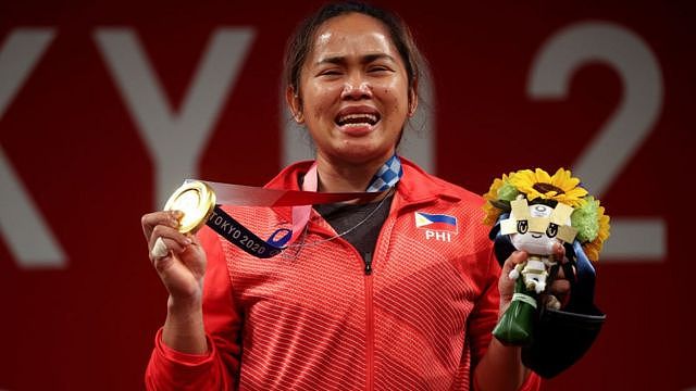 Filipino weightlifter Hidilyn Diaz celebrates her win at the Tokyo Games