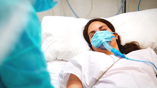 Woman in hospital bed