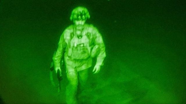 U.S. Army Major General Chris Donahue, commander of the 82nd Airborne Division, steps on board a C-17 transport plane