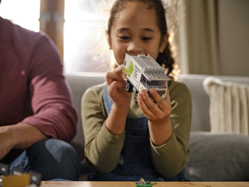 Woolworths Bricks - Girl with truck.png,0