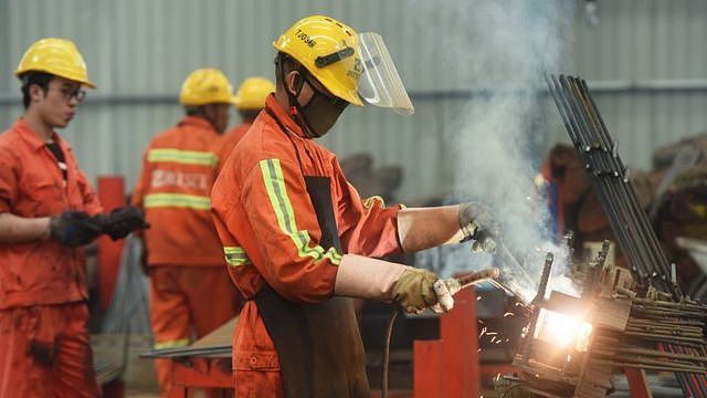 A worker in a steel processing plant in China