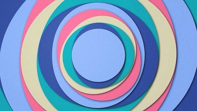 一系列不同颜色的圆圈，如紫色、靛蓝色、绿色、奶油色和粉红色