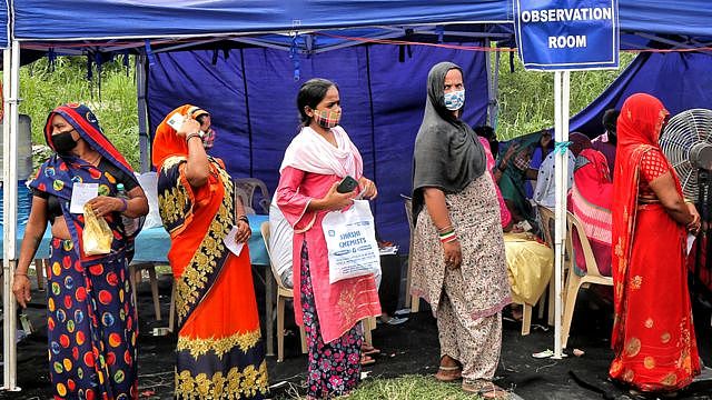 People waiting to get vaccinated against Covid-19 at a camp in Rajghat, on 15 September 2021 in New Delhi, India