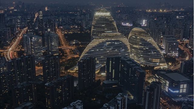 The Wangjing SOHO development is illuminated at night on October 6, 2020 in Beijing, China.