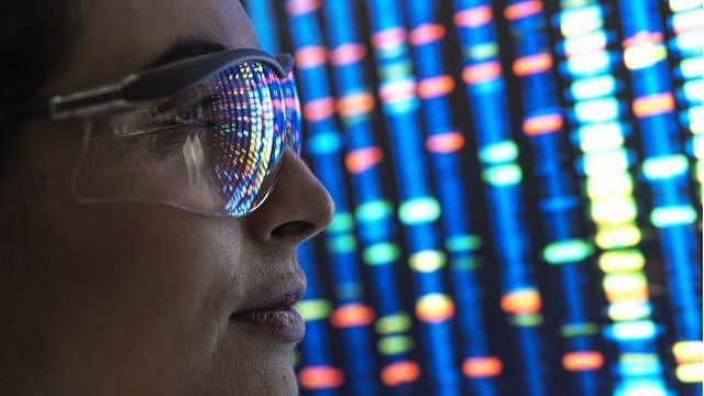 Scientist looking at genetic code