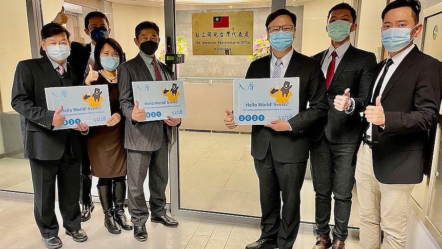 Eric Huang, third from right, poses with other staffers outside the Taiwan Representative Office in Vilinius, Lithuania