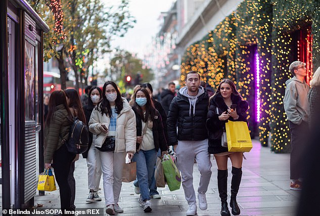 AstraZeneca is suspected to cause a longer life T-cell response than other vaccines - a vital part of the immunity process - which could make it more effective in a long-term battle against Covid (pictured, early Christmas shoppers in London)