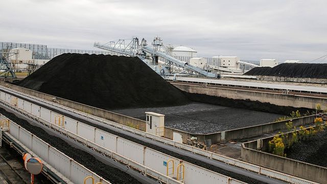 Coal piles are seen at JERA