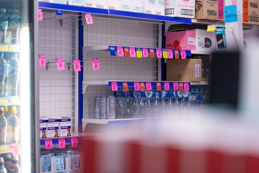 A picture of empty shelves where RAT kits were.