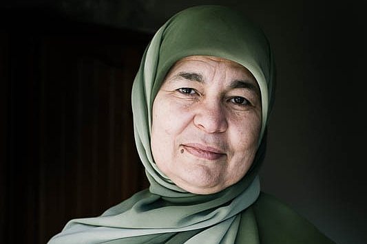 A close up potrait of a woman wearing headscarf