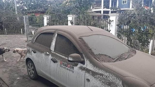 A car covered in ash