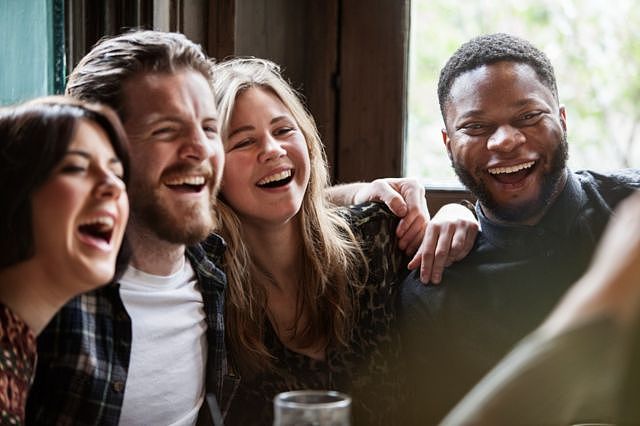 A group of friends smiling and laughing