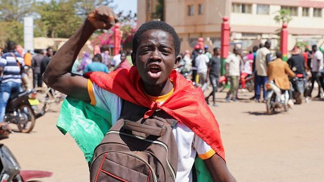 A teenager reacts as he shows support for the military after Burkina Faso President Roch Kabore was detained at a military camp in Ouagadougou, Burkina Faso, January 24, 2022