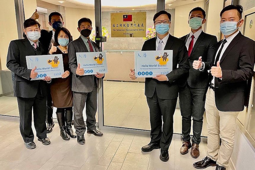 Eric Huang, third from right, poses with other staffers outside the Taiwan Representative Office in Vilinius, Lithuania