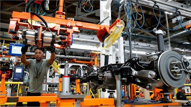 Workers assemble cars at the newly renovated Ford's Assembly Plant in Chicago, June 24, 2019.