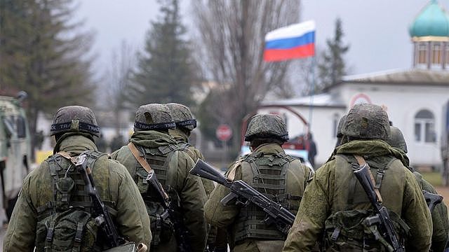 Russian soldiers patrol the area outside Simferopol, Crimea, 2014