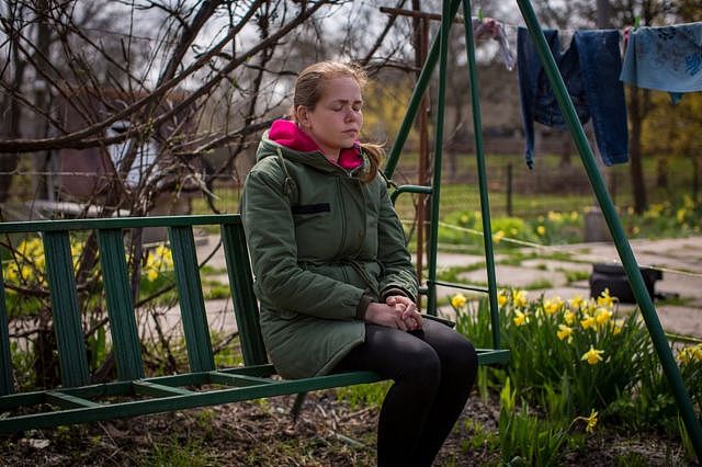 Maria Sayenko in her garden in Hurivshchyna. 