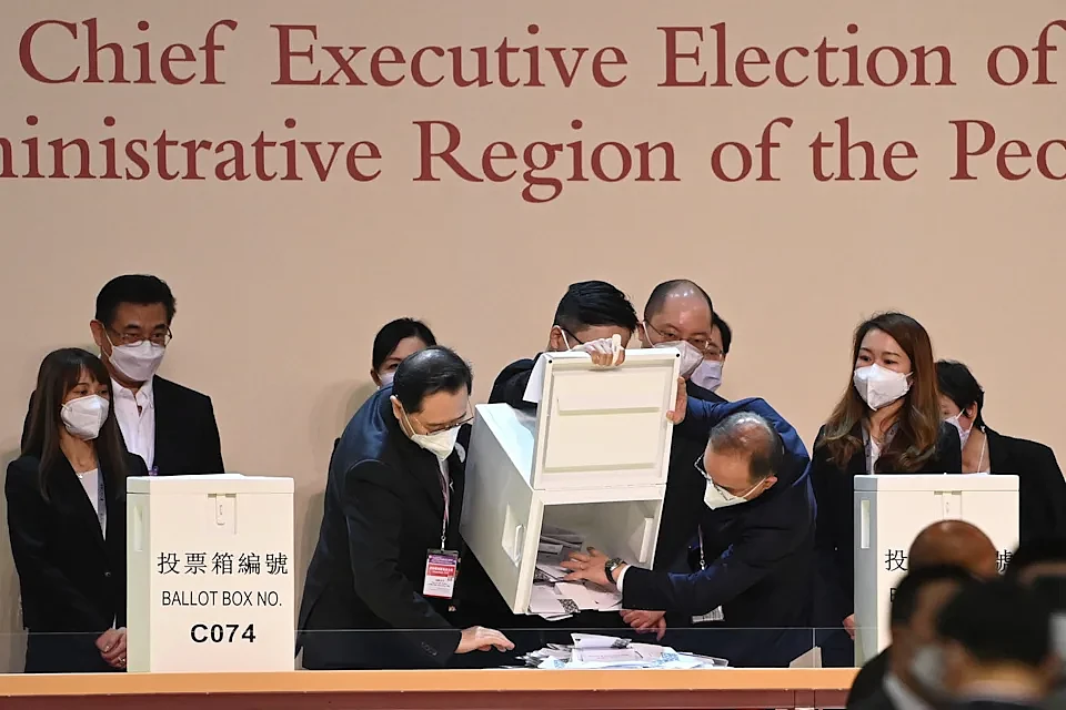 A ballot box is tipped out to start the vote counting during the selection process of the city's next chief executive in Hong Kong on May 8, 2022. - John Lee, 64, was expected to be anointed Hong Kong's next chief executive by a small committee on May 8, the culmination of a choreographed, Beijing-blessed race with no other candidates. (Photo by Peter PARKS / AFP) (Photo by PETER PARKS/AFP via Getty Images)