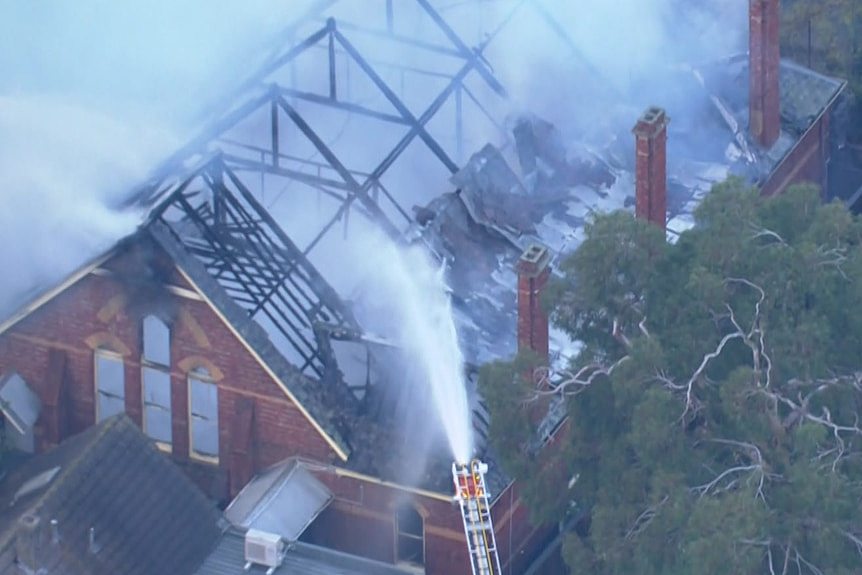 Smoke rises from a burning church