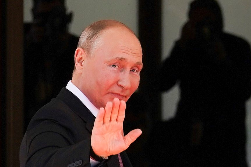 Vladimir Putin hands up