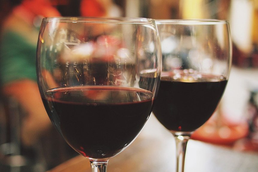 Two glasses of red wine.