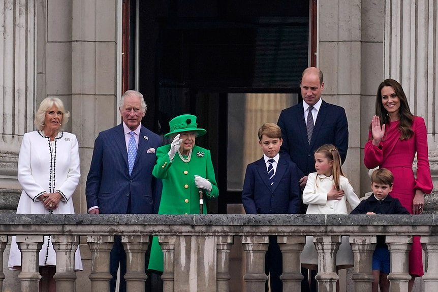 Queen Elizabeth II waves to the crowd during the Platinum Jubilee Pageant outside Buckingham Palace.