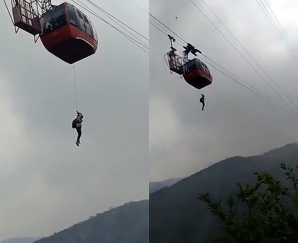 纜車故障，遊客只能抓著手上的「救命繩」，緩緩的從1000英尺高的半空中垂降至地面。（圖片翻攝自YouTube/The Mirror）