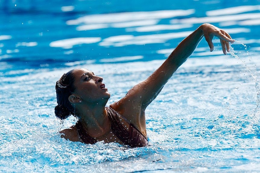 Swimmer Anita Alvarez performs a dance in the pool.