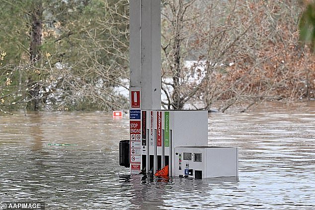 A submerged petrol station as floodwaters continued to rise in Camden on Sunday