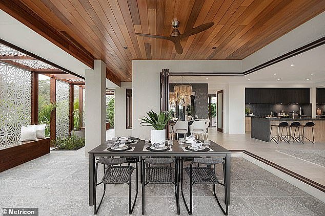 The $1.2million Metricon home in Chisholm, near Newcastle, has a large outdoor dining area (above)