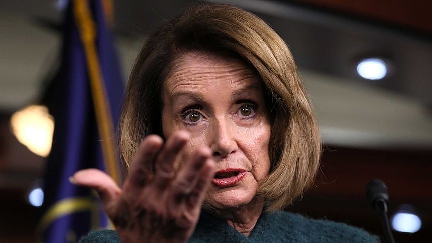 US House Speaker Nancy Pelosi gestures while speaking to reporters