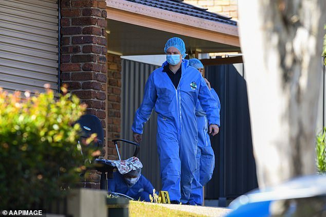 Police hope to remove the bodies of a man and a woman from the home by Monday night