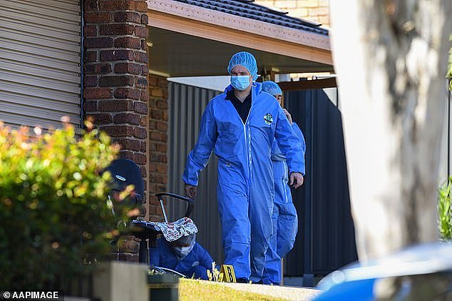 Police hope to remove the bodies of a man and a woman from the home by Monday night