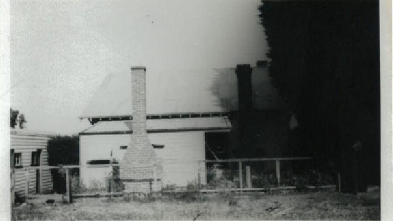 An old black and white photo of a house. 