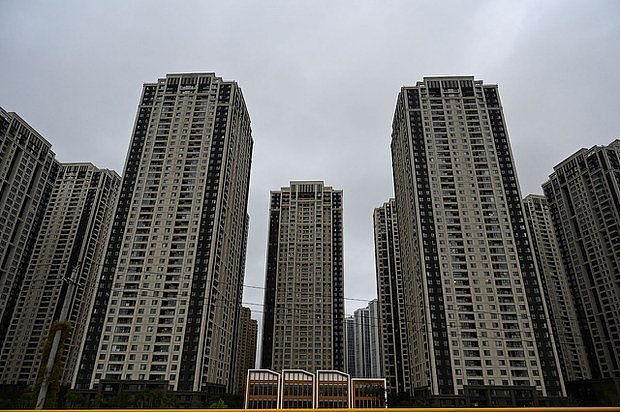 中国恒大集团在河南洛阳开发的住宅区恒大绿洲未完工的住宅楼（路透社）