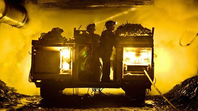 Miners in a mine shaft