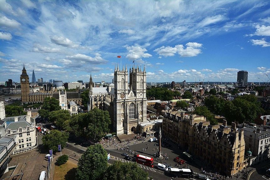 Westminster Abbey surrounded by London skyline.