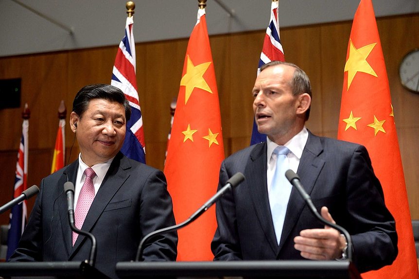 The President of China Xi Jinping and Australian Prime Minister Tony Abbott speak during a press conference