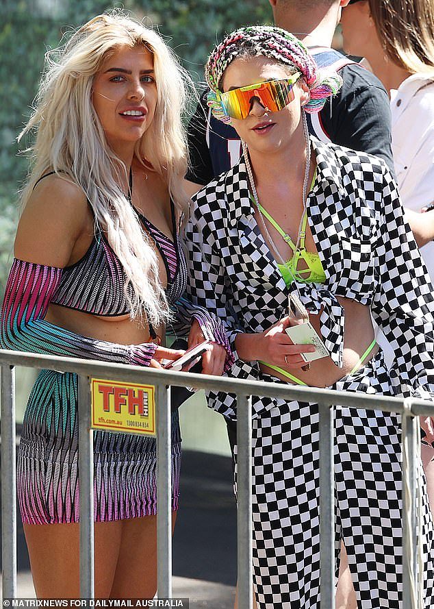 Revellers took to the dance floor with the Sydney Harbour Bridge and Opera House views wearing an assortment of funky ensembles (pictured) and skin-tight florescent garb