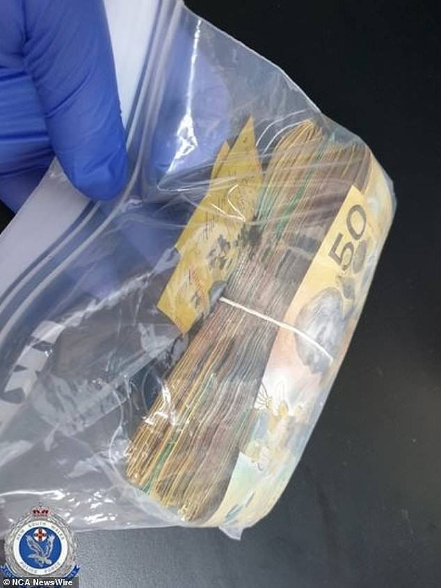 Police also allegedly found $16,500 in cash (pictured) in the sleeping man's car