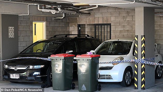 The complex car park remained cordoned off on Thursday hours after the grim discovery of 'tightly wrapped' human remains