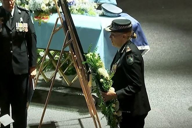 Queensland Police Commissioner Katarina Carroll lays a wreath at the memorial service.