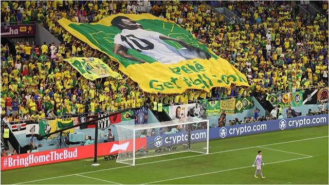 Brazil fans hold a banner showing support for former Brazil player Pele during the FIFA World Cup Qatar 2022 Round of 16 match between Brazil and South Korea at Stadium 974 on December 05, 2022 in Doha, Qatar.