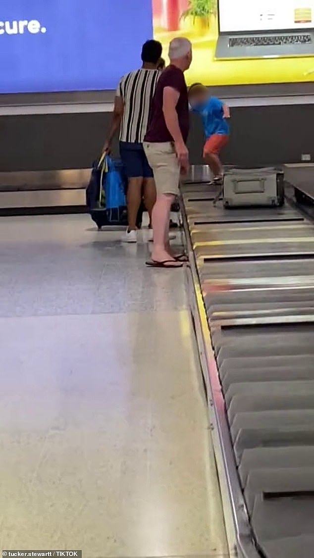 The video showed the child ignoring his mother telling him to get off and running rampant on the conveyor belt