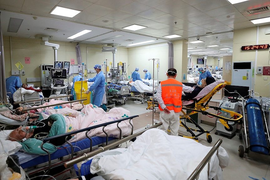 Medical workers attend to patients at the intensive care unit of the emergency department at Beijing Chaoyang hospital 