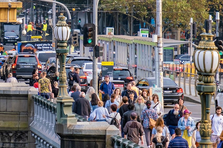 Pedestrians on Princes Bridge in Melbourne