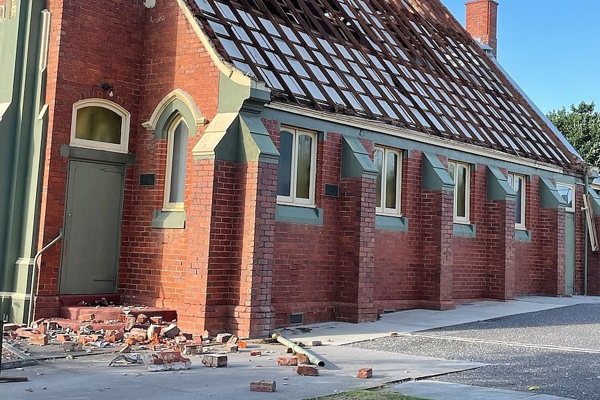 A brick church damaged by a storm.