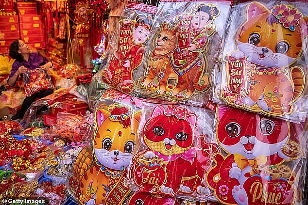 Stickers with cat image are pictured at the Spring Festival Fair in the Old Quarter on January 14, 2023 in Hanoi, Vietnam
