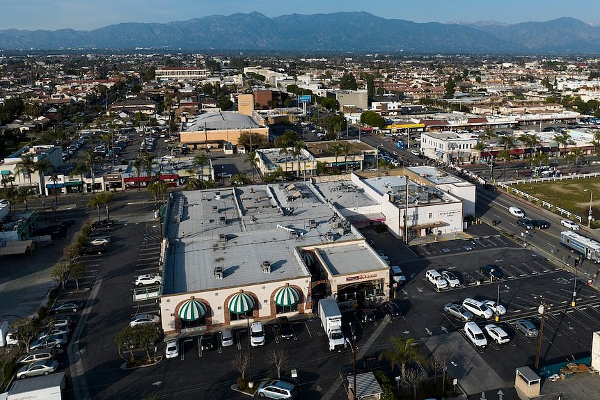 A view from above showing the dance studio and a large carpark. 